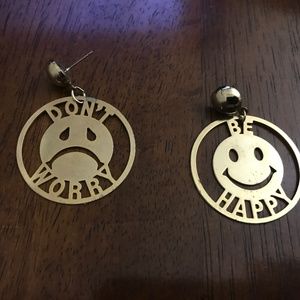 Goldtone pierced earrings don’t worry be happy